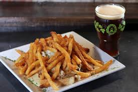 Obed and Isaac’s Microbrewery and Eatery signature dishes Horseshoe Sandwich, Scotch Eggs, Beer Battered Fish and Chips, The Steeple Burger